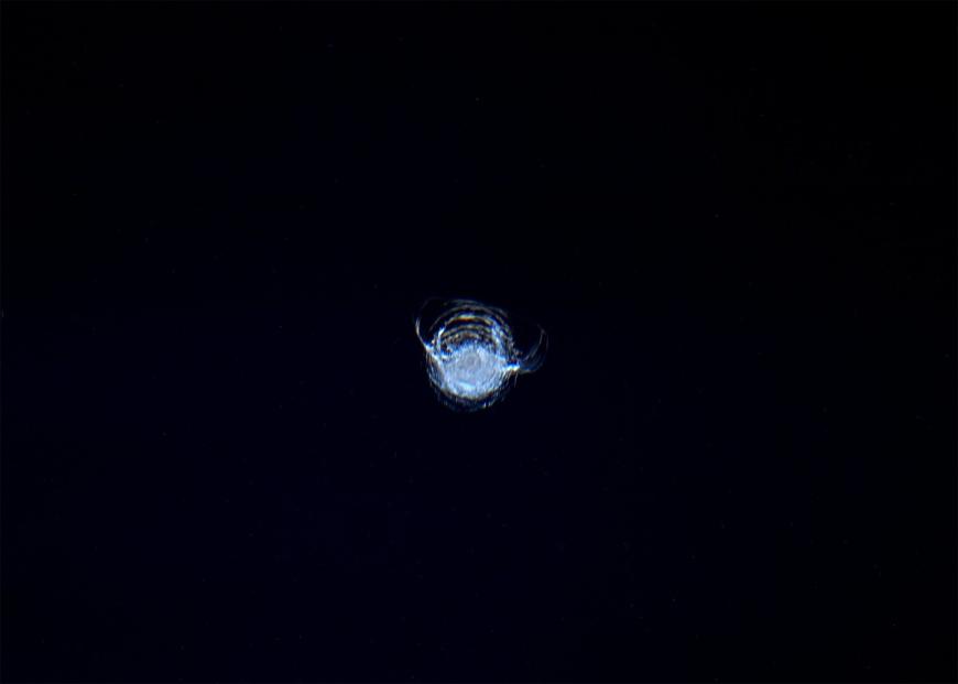 The 7-millimeter chip in the glass of the Cupola module, photographed by Tim Peake