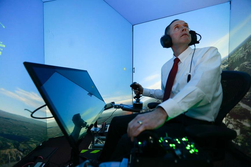 Retired US Air Force Colonel, Gene Lee, in a flight simulator