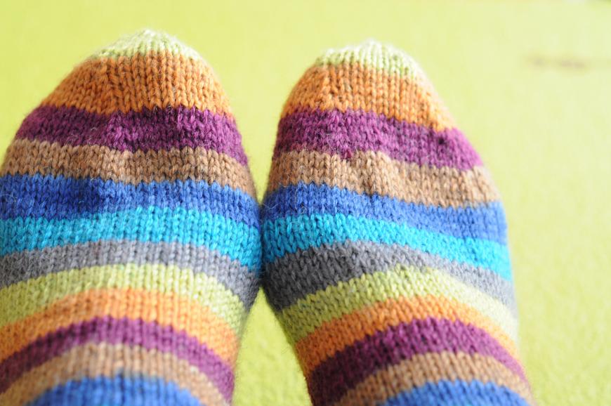A pair of striped rainbow colored socks