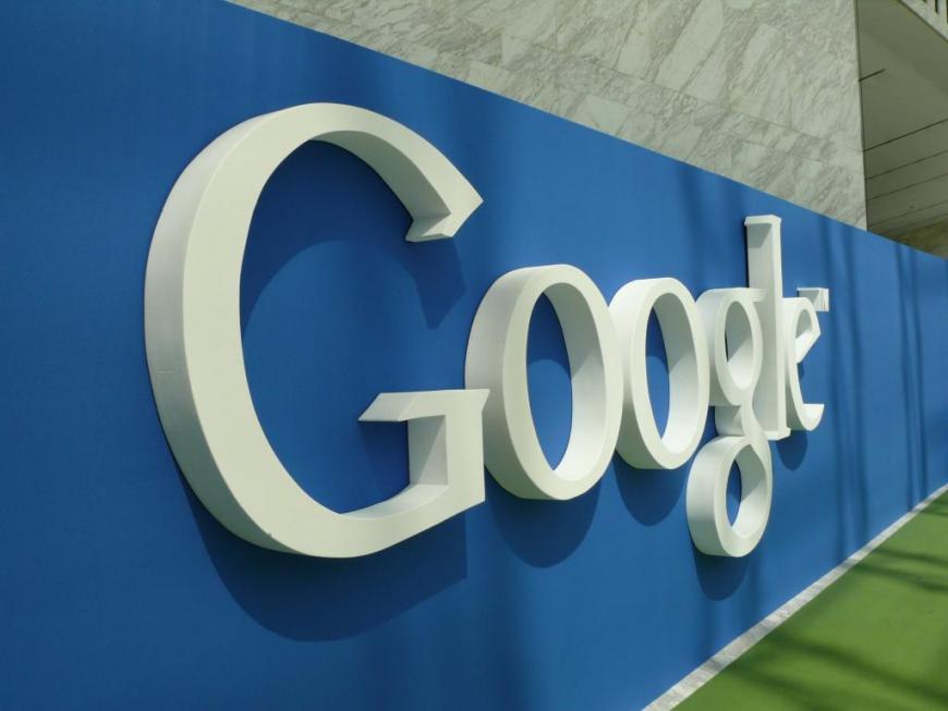 White Google logo on blue background