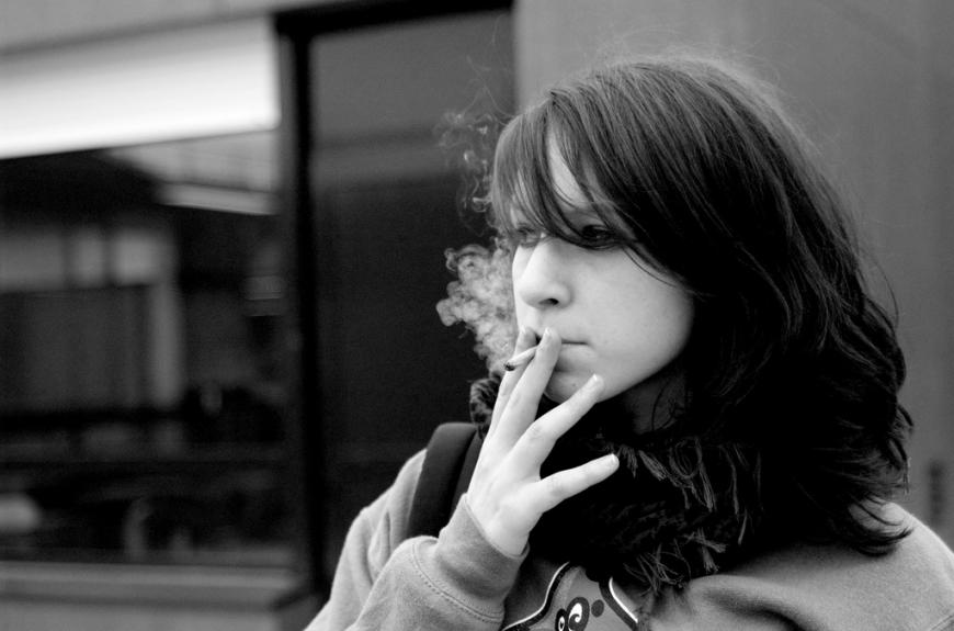 Young woman smoking a joint