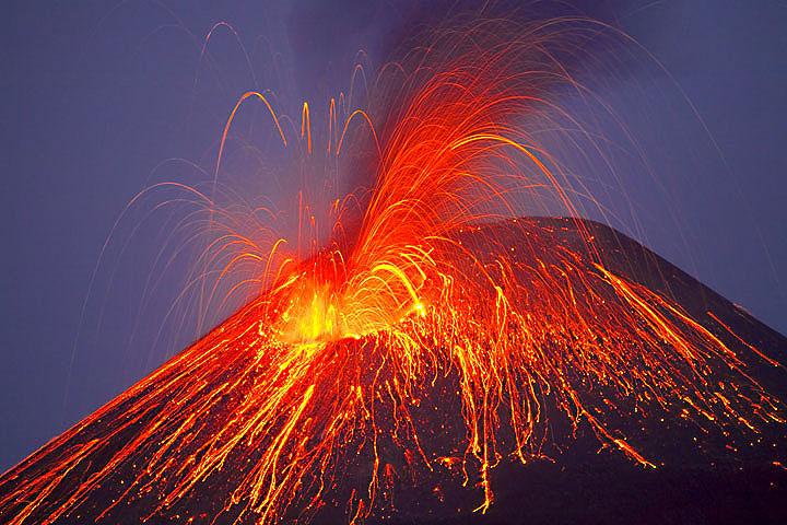 volcano erupting against a night sky
