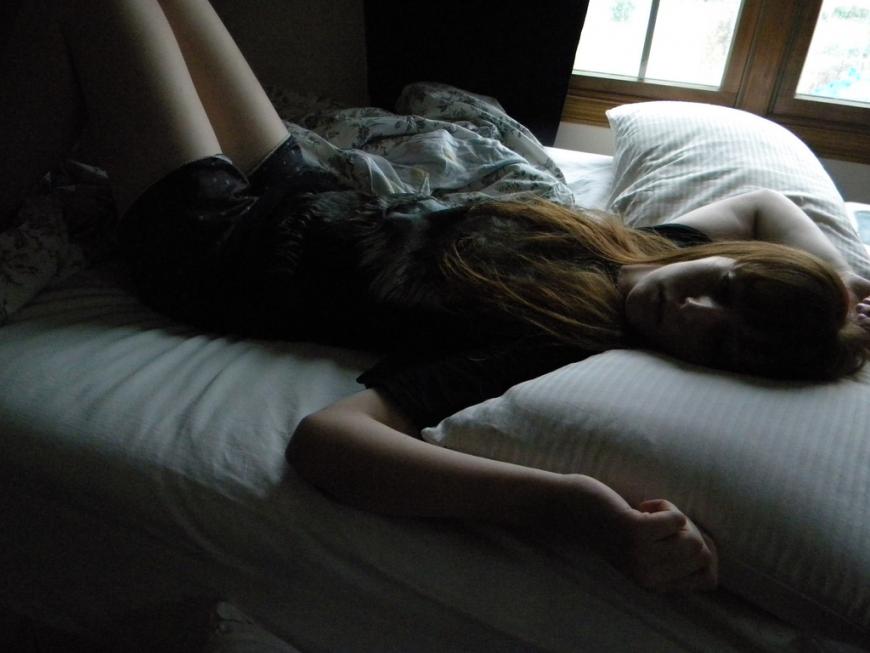 Girl sleeping on a bed