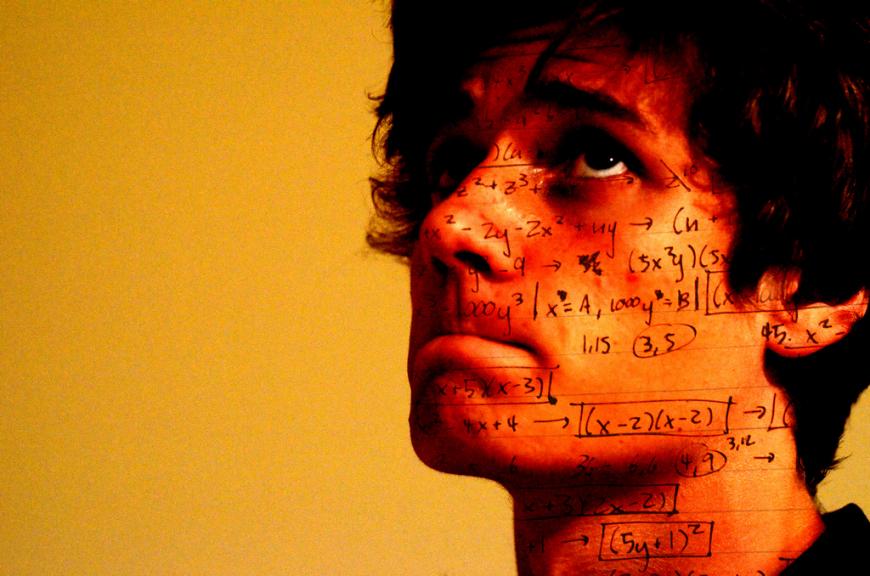 Orange image, man&#039;s face with math formulas across his skin