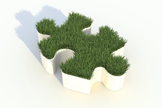 3D puzzle piece containing grass