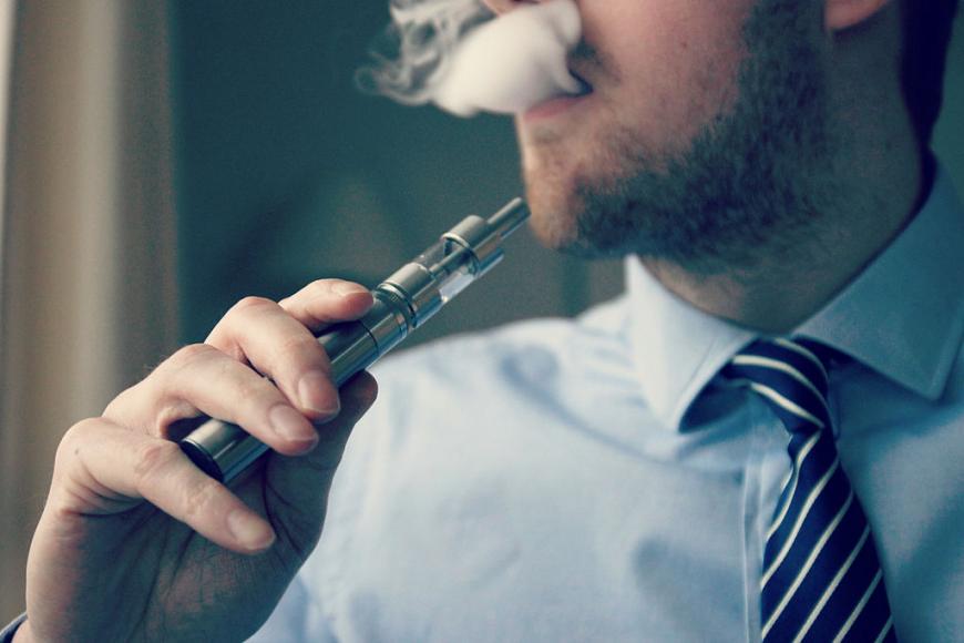 Man vaping with an e-cigarette