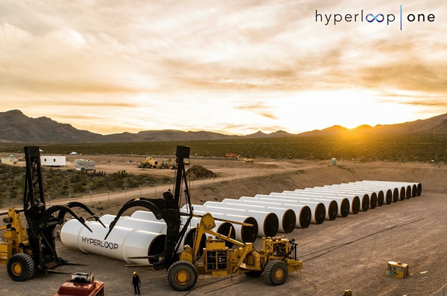 Sections of Hyperloop track being assembled. Sunset in the desert