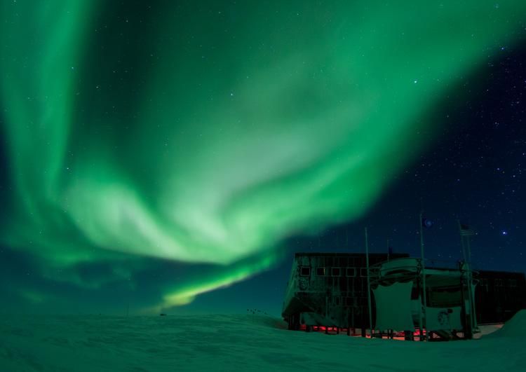 Aurora borealis above the IceCube Lab at the South Pole.