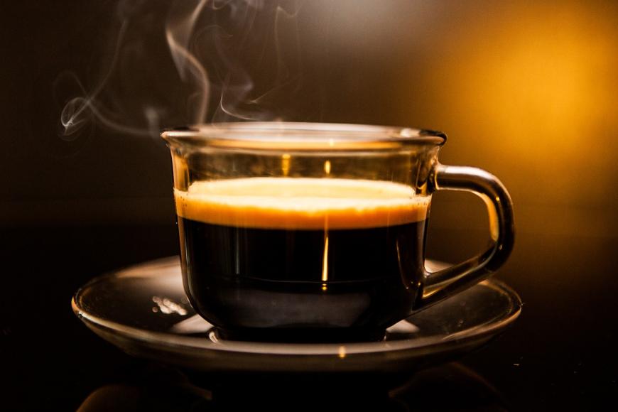 Steaming cup of hot coffee