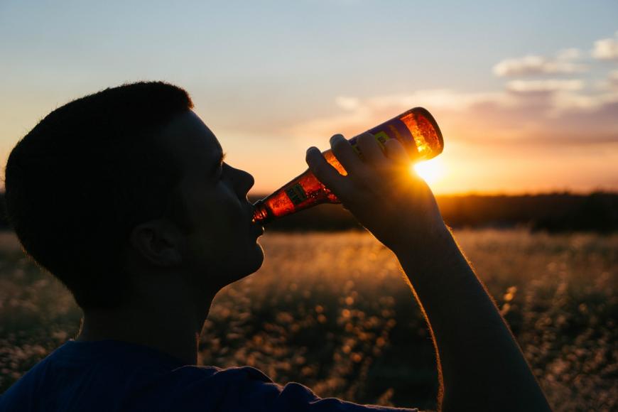 Drinking beer at sunset