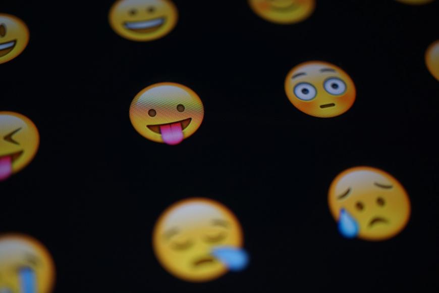 Texting emojis on a smartphone screen.