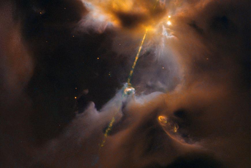 light saber-like stream of light from a newborn star