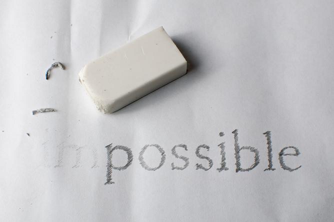 The word &quot;Impossible&quot; written in pencil, partially erased