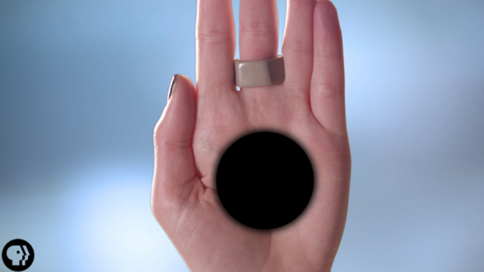 Optical illusion of a black hole in the middle of a hand
