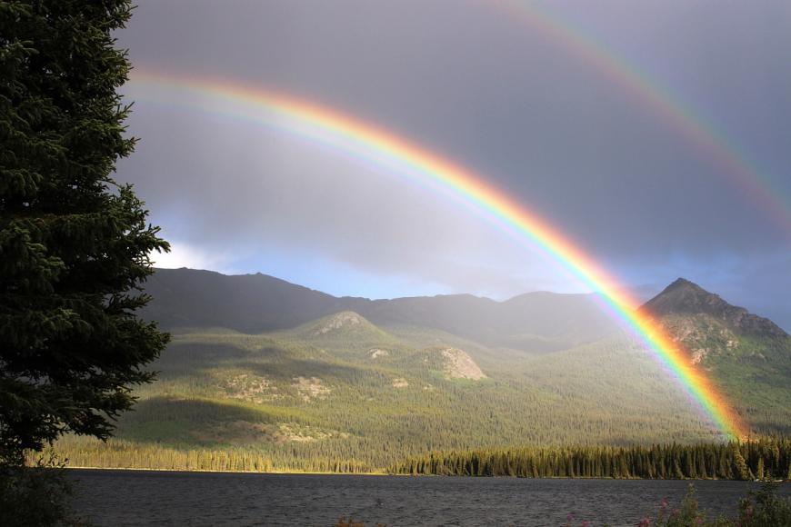 A double rainbow over a lake