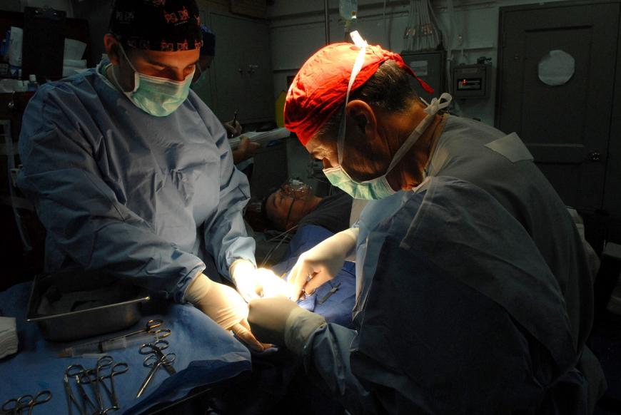 Doctors conducting surgery in the operating room