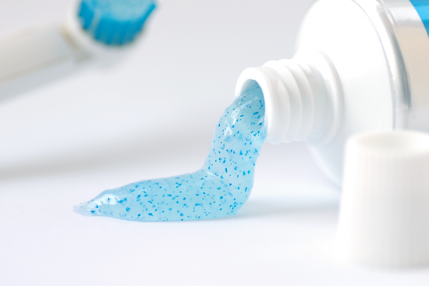 Toothpaste containing blue microbeads.