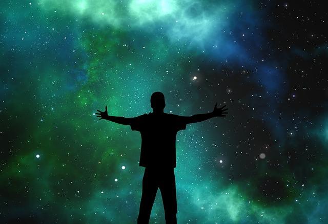 Silhouette of a person against the cosmos