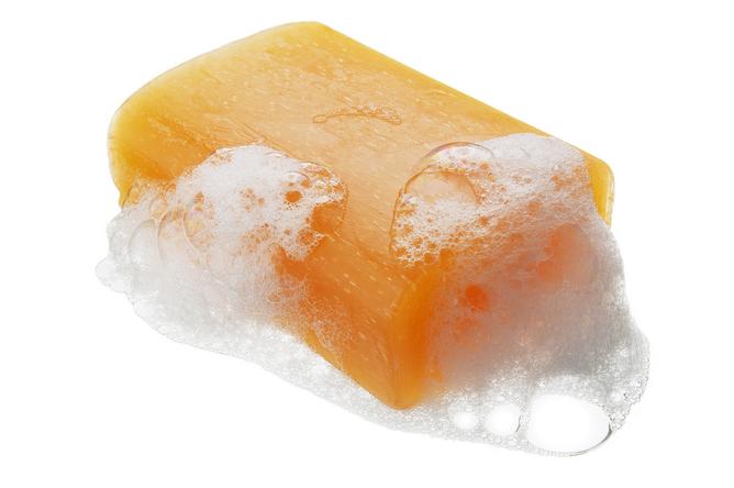 An orange bar of sudsy soap