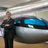 Jerry Sanders, CEO of SkyTran, standing by a prototype. Image courtesy of: www.skytran.com