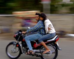 Man and woman riding a motorcycle