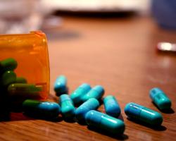 Prescription bottle of blue pills