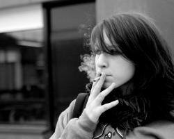 Young woman smoking a joint