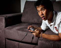 Man playing video game on an Xbox