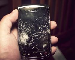 Broken glass screen of a smartphone, blackberry