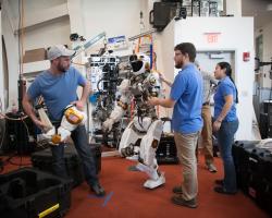 Valkyrie the NASA robot surrounded by researchers at MIT CSAIL