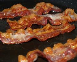 Bacon sizzling in a frying pan