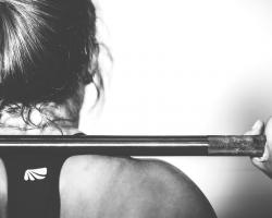 Woman weight-lifting. Black and white.