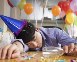 Drunk man passed out on table at birthday party