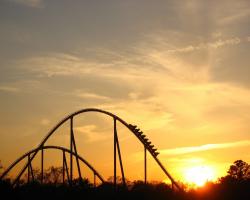 Sunset behind a roller coaster