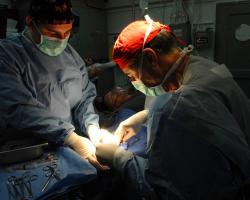 Doctors conducting surgery in the operating room