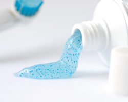 Toothpaste containing blue microbeads.