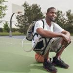 Man sitting in basketball court