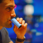 Man breathes into Aire, a pocket breathalyzer that analyzes digestion